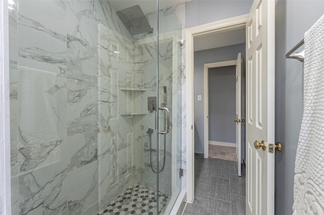 bathroom featuring an enclosed shower and tile patterned floors