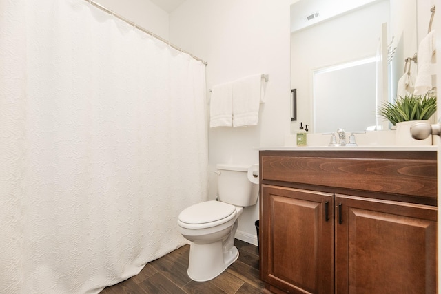 bathroom with toilet and vanity