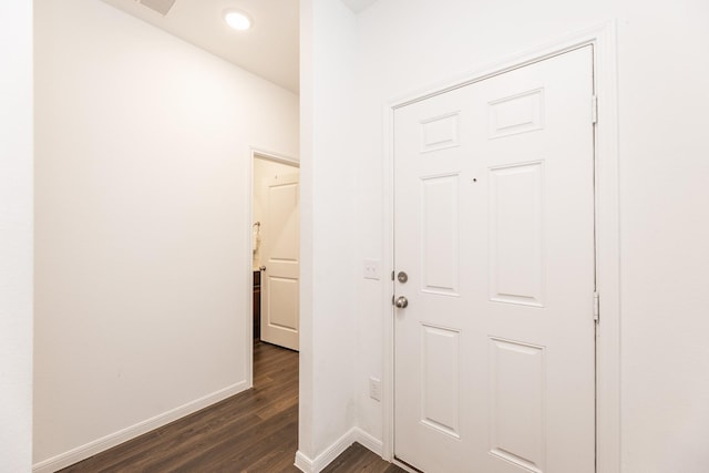 corridor featuring dark hardwood / wood-style floors