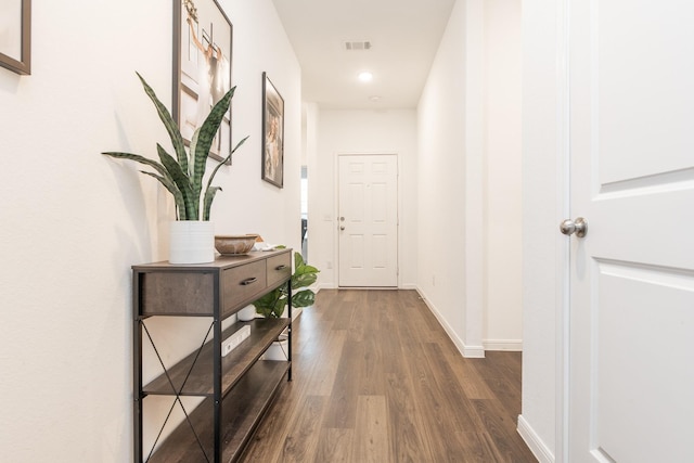 hall with dark hardwood / wood-style flooring