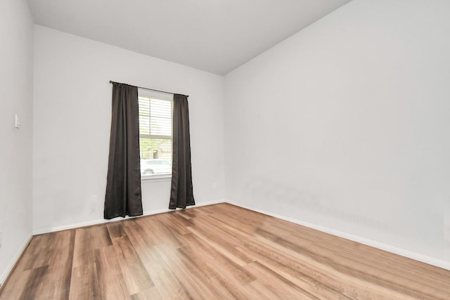 spare room featuring hardwood / wood-style floors