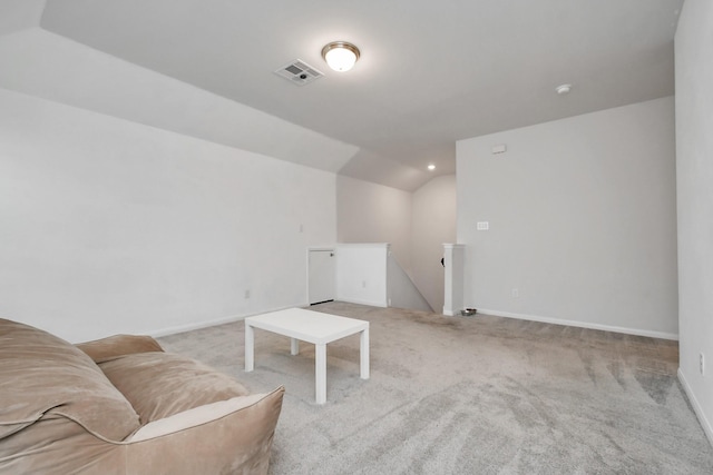 sitting room featuring vaulted ceiling and light carpet