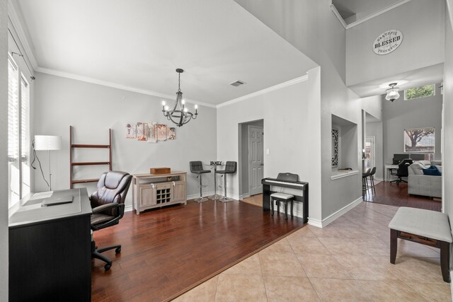 tiled office space with an inviting chandelier and ornamental molding