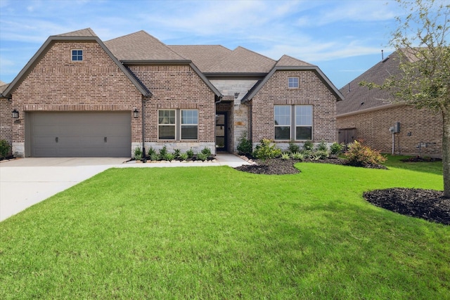 view of front of home with a front yard and a garage