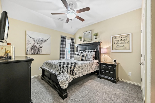 carpeted bedroom with vaulted ceiling and ceiling fan