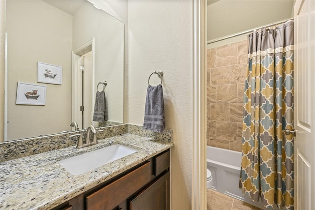 full bathroom with vanity, shower / bath combo with shower curtain, and toilet