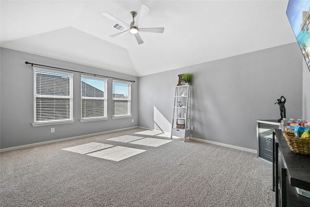 unfurnished living room with lofted ceiling, light colored carpet, and ceiling fan