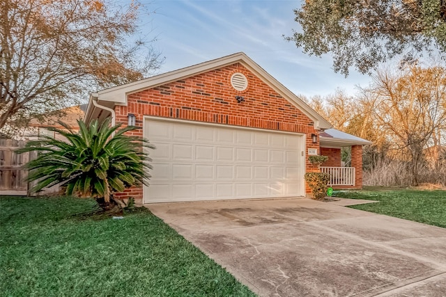 view of front of home featuring a garage and a front lawn