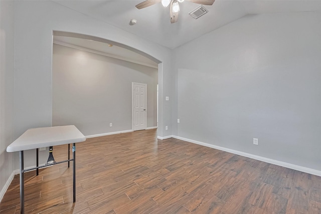 unfurnished room with ceiling fan, hardwood / wood-style floors, and lofted ceiling