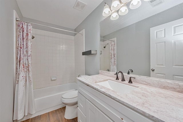 full bathroom featuring hardwood / wood-style flooring, toilet, vanity, and shower / bath combo