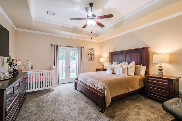 carpeted bedroom featuring ceiling fan, french doors, access to outside, and a tray ceiling