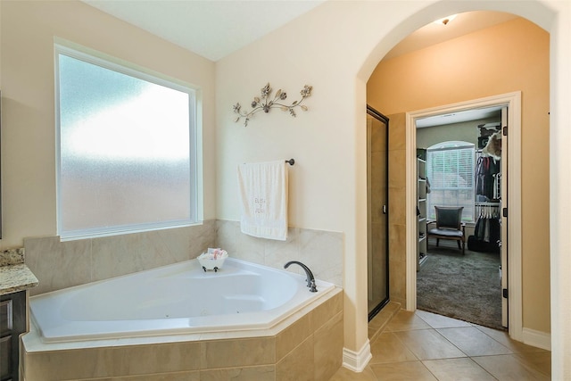 bathroom featuring separate shower and tub, tile patterned flooring, and vanity