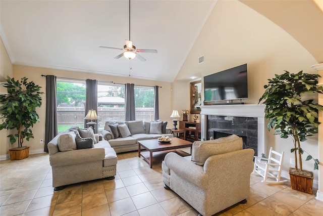 tiled living room featuring high vaulted ceiling, a fireplace, and ceiling fan