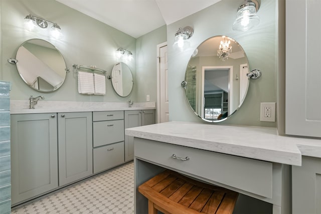 bathroom featuring vanity and an inviting chandelier