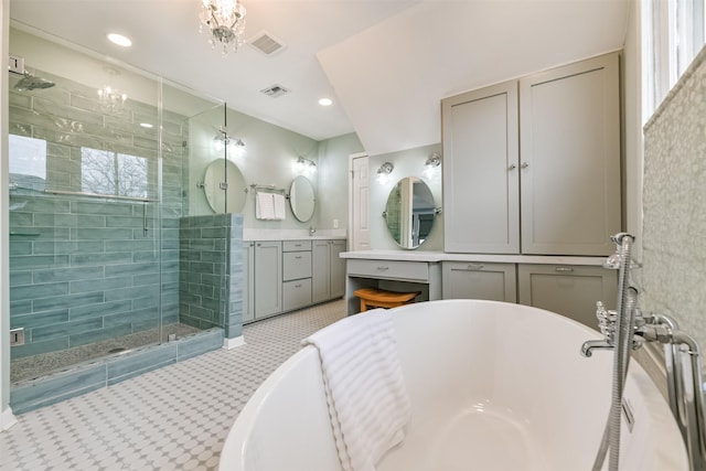 bathroom with tile patterned flooring, vanity, and shower with separate bathtub