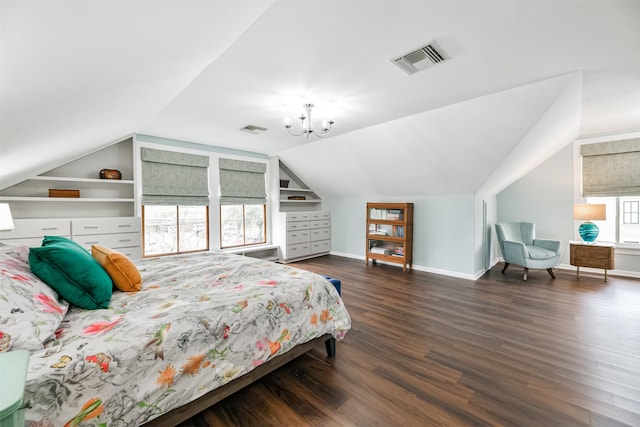 bedroom with a notable chandelier, dark wood-type flooring, and lofted ceiling