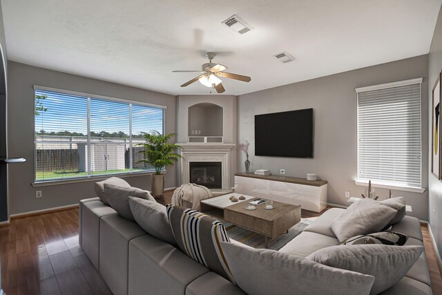 living room featuring ceiling fan and hardwood / wood-style flooring