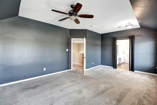 unfurnished bedroom with ensuite bath, ceiling fan, and light colored carpet