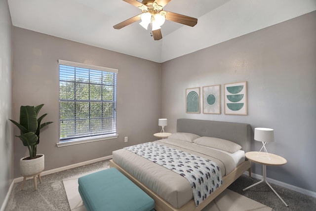 bedroom with lofted ceiling, ceiling fan, and carpet