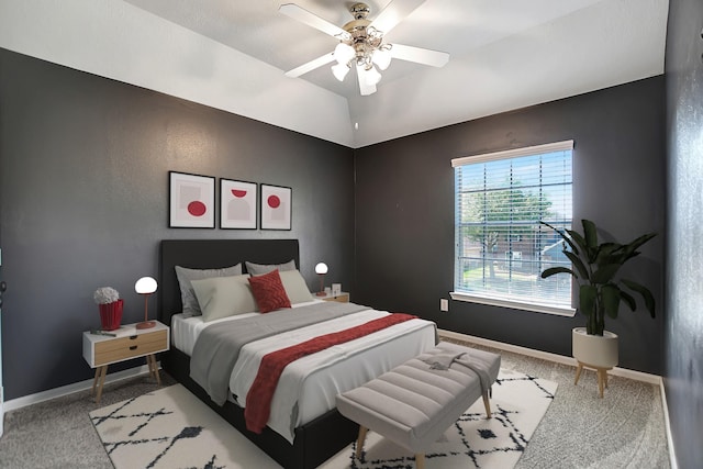 bedroom with ceiling fan and light colored carpet