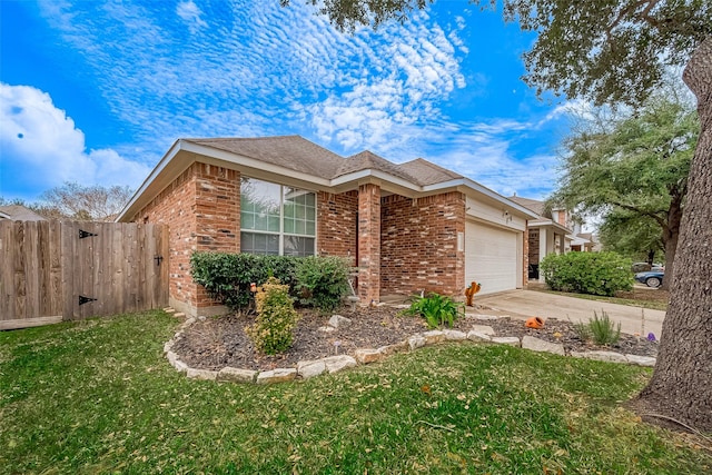 view of front of house featuring a front yard and a garage