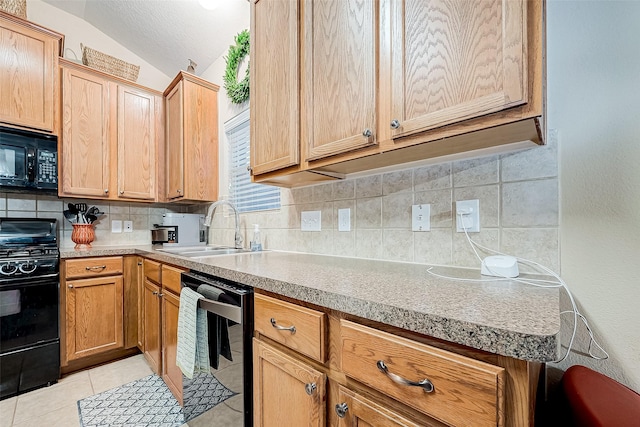 kitchen with vaulted ceiling, black appliances, light tile patterned flooring, sink, and backsplash