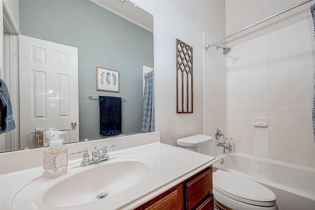 full bathroom featuring toilet, tiled shower / bath combo, and vanity