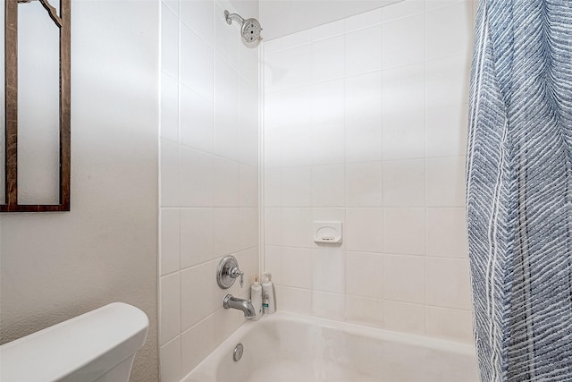 bathroom with toilet and shower / bath combination with curtain