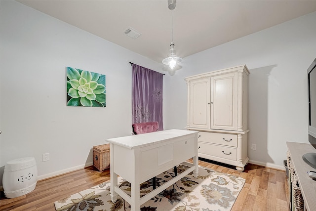 office area with light hardwood / wood-style floors