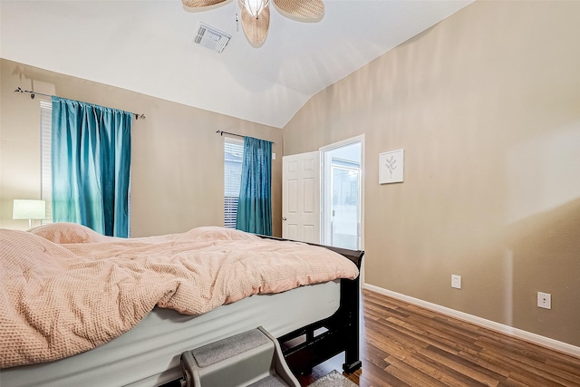 bedroom with hardwood / wood-style flooring, ceiling fan, and vaulted ceiling