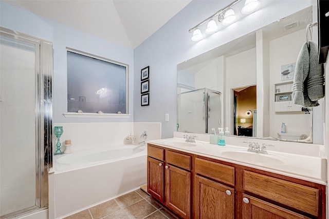 full bathroom with toilet, shower with separate bathtub, vaulted ceiling, and vanity