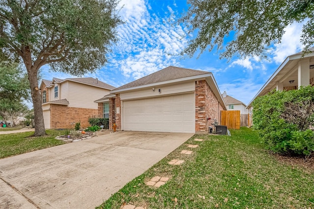 view of front of house with a front yard and a garage