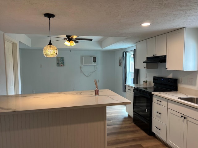 kitchen with a textured ceiling, white cabinetry, electric range, pendant lighting, and dark wood-type flooring