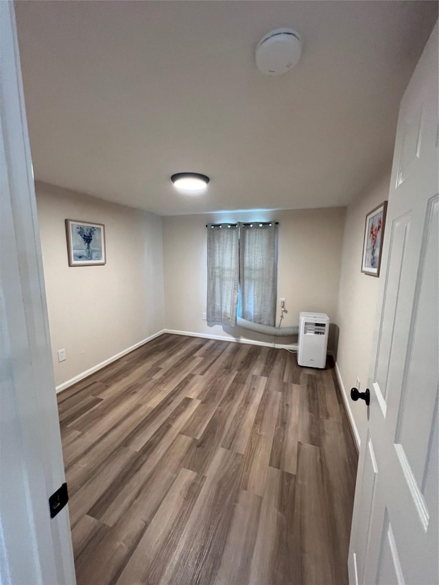 empty room featuring hardwood / wood-style flooring