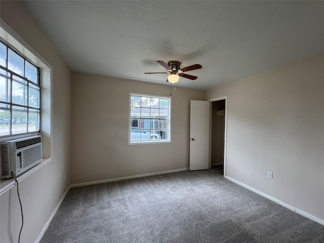 carpeted empty room with cooling unit and ceiling fan