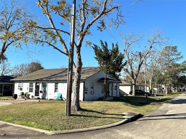 ranch-style house with a front lawn