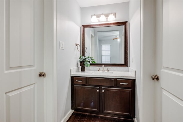 bathroom with hardwood / wood-style floors and vanity