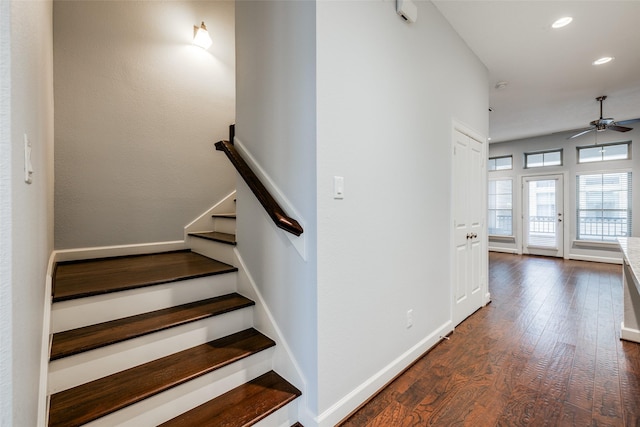 stairs with ceiling fan and wood-type flooring