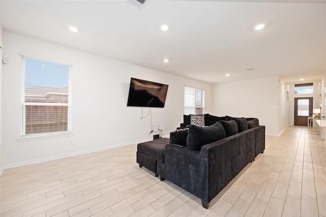 living room with light hardwood / wood-style floors