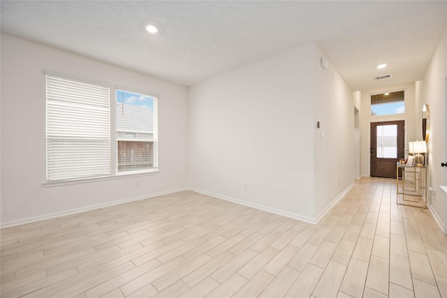 empty room with light wood-type flooring