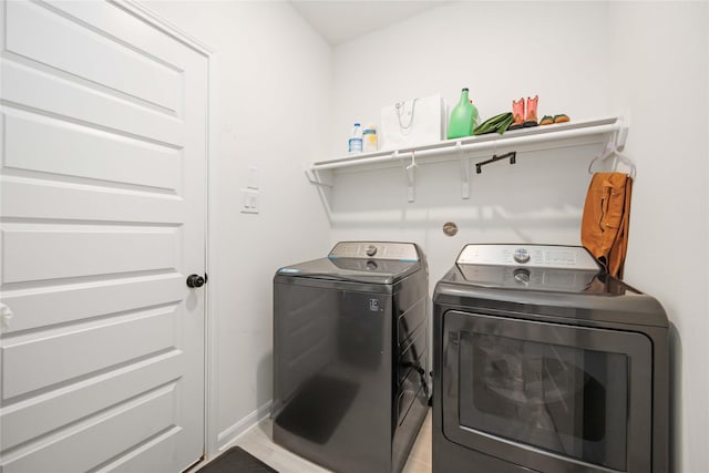 clothes washing area featuring washer and dryer