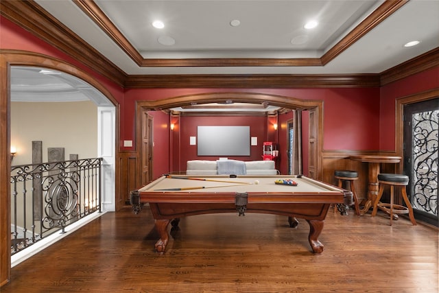 rec room featuring a raised ceiling, wood-type flooring, and pool table