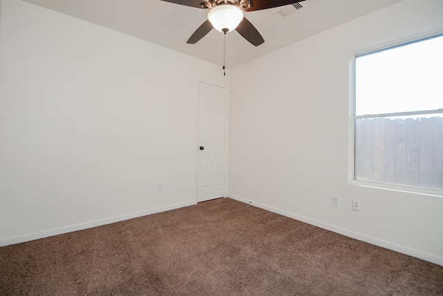 carpeted empty room with ceiling fan