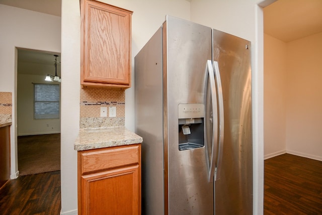 kitchen with stainless steel fridge with ice dispenser, backsplash, and dark hardwood / wood-style floors