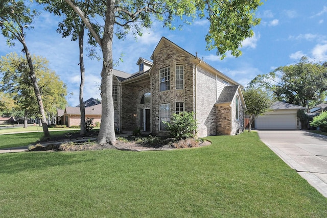 view of front property featuring a front lawn and a garage