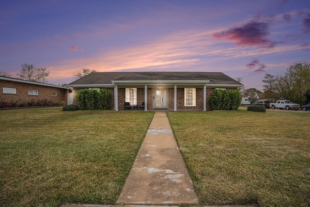 single story home with a yard