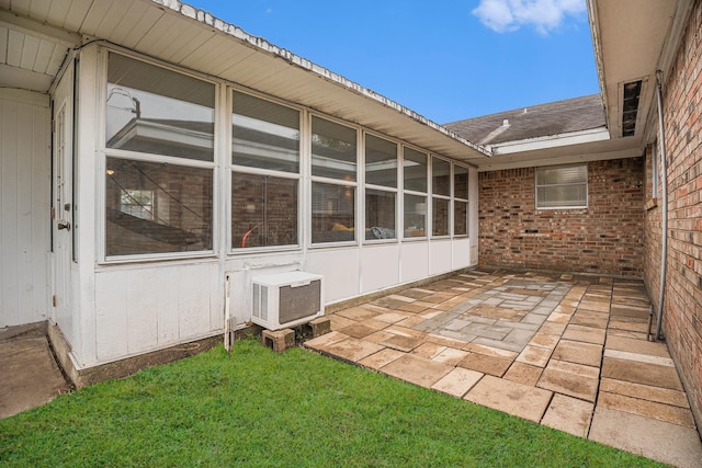 view of patio / terrace with a sunroom