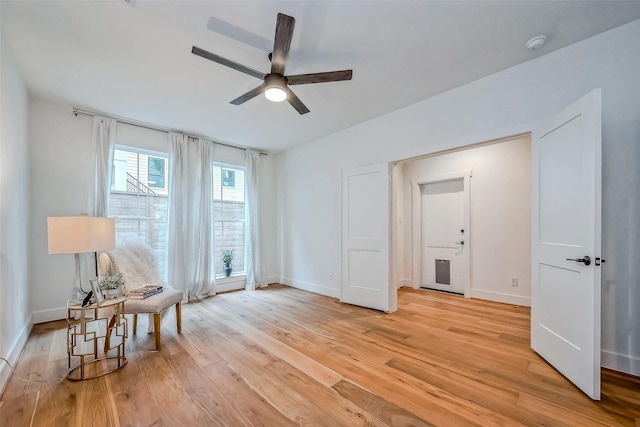 interior space with ceiling fan and light hardwood / wood-style flooring