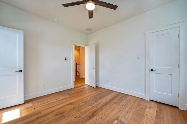 unfurnished bedroom featuring ceiling fan and light hardwood / wood-style floors