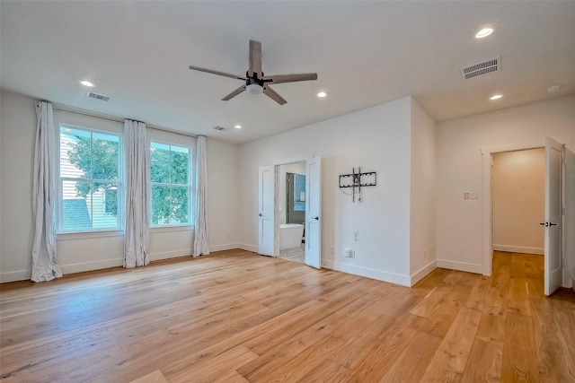 empty room featuring light wood-type flooring and ceiling fan